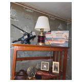 book shelf, clocks, table lamp, model plane