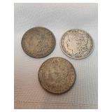 Three 1884 Morgan Silver Dollars, One With An O