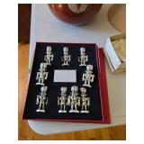 Metal nutcracker place settings with cards