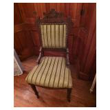 Eastlake Victorian parlor chair with intricate carvings