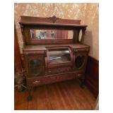 Empire-style buffet cabinet with curved glass display