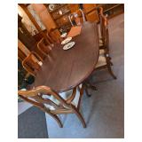 Wooden dining room table with chairs and table pads, 3 tier candy dish 