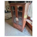 Entertainment center with glass doors