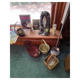 Assorted books, wicker baskets, floor lamp,