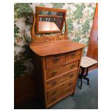 Vintage early American tiger oak tall chest of drawers with a swivel mirror from the pre-WWII era.It