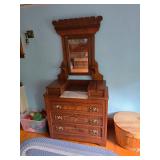 Victorian-era Eastlake style dresser features a marble top and a swivel mirror, Round wood basket st