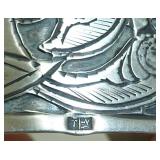 signature on silver cuff