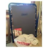 Full-size cot for those overnight guests, with Tommy Hilfiger sheets