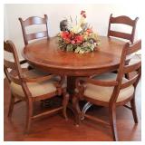 Great round dining table with 4 chairs and extra leaf