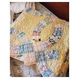 Several vintage handsewn quilts