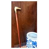Cane with brass horse head handle