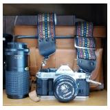 Canon camera with case and lens