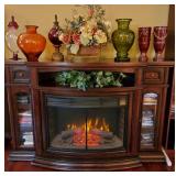 Stunning electric fireplace/ media console with rotating insert that turns around to be a cabinet