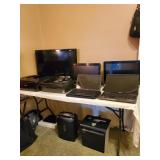 Lots of computers and office equipment