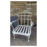 Several metal outdoor patio chairs and Tables