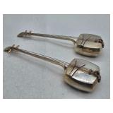 A pair of Japanese sterling dress clips marked Sterling Japan with shield form backs and long hinged clip mechanisms, circa 40s.