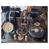 Owned by Dr. A. T. Smith of MCV, a McIntosh Electrical Corporation Chicago USA No 1058 Poly-Sine Generator electrical apparatus in an industrial style wood case with a glass lid featuring a milliamper