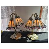 Pair of stained table lamps with floral motif and leaf-shaped bases, in working condition; measures 