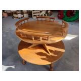 Wooden two-tier round table with spindle railings; measures 27" 28