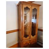 Wooden gun display cabinet with glass doors and key measures 78" 32" 16.5"