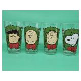 Four Peanuts World LLC glass tumblers featuring character designs from 2015