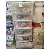  Plastic storage drawers containing various craft supplies including cross stitch fabric, beads, and