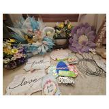 Group of Easter-themed decorative items including wreaths, signs, and floral arrangements