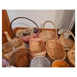 Large lot of assorted woven baskets in various shapes and sizes.