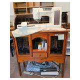 Baby Lock Ellageo sewing machine with extension table and accessories with mat, Powers on and measur