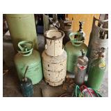 Group of assorted gas cylinders and welding equipment