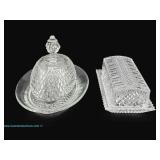 Two cut glass butter dishes with intricate diamond patterns