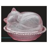 Pink glass covered dish in the form of a sleeping cat
