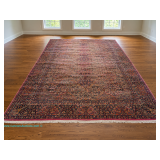 Karastan Kirman pattern 717 power loomed area rug with red, navy, cream, and gold Persian-style flor