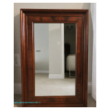 Wooden framed mirror with beveled edges; measures 21" x 31.5"