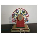 The Starburst Ferris wheel model with colorful lights and decorative details, in working condition