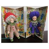 Two Lenci dolls in colorful costumes with original boxes .
