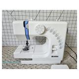 Kenmore sewing machine with foot pedal, powers on and measuring boar