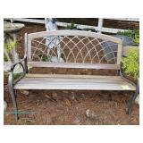  Metal garden bench with decorative backrest and curved armrests; measures 49.5"x 31.5" x 22"