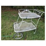 White metal outdoor serving cart with floral design and two tiers; measures 37" x 33" x 20"
