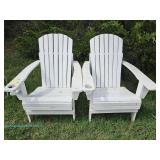 Two white wooden Adirondack chairs with cup holders; measures 29" x 36" x 38"