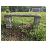 Concrete garden bench with decorative scroll legs; measures 40" x 14" x 15"