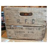 Wooden crate marked Ranson Fruit Co. with metal brackets and a plastic ring inside