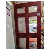 Red wooden door with six glass panels; measures 36" x 80" 