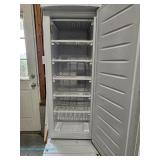  Thomson upright freezer with manual defrost and adjustable shelves, in working condition; measures 