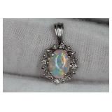 OPAL PENDANT DIAMOND PLATINUM PT900 AUSTRALIAN CRYSTAL O.64CT D.04CT  https://www.liveauctioneers.co