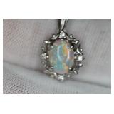 OPAL PENDANT DIAMOND PLATINUM PT900 AUSTRALIAN CRYSTAL O.64CT D.04CT  https://www.liveauctioneers.co