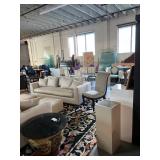 Many couches and fantastic rugs 