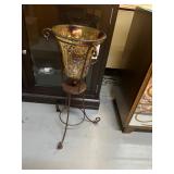glass and iron pedestal vase