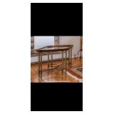 2 side glass top tables with wood trim and metal