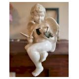 Large shelf sitting ceramic Angel with flower 13" tall numbered 143/2500